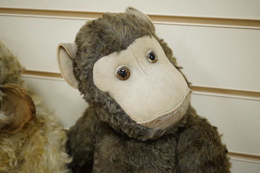 A Merrythought gold mohair monkey, with jointed limbs, and one other jointed monkey, Merrythought 62cm. Condition - poor to fair